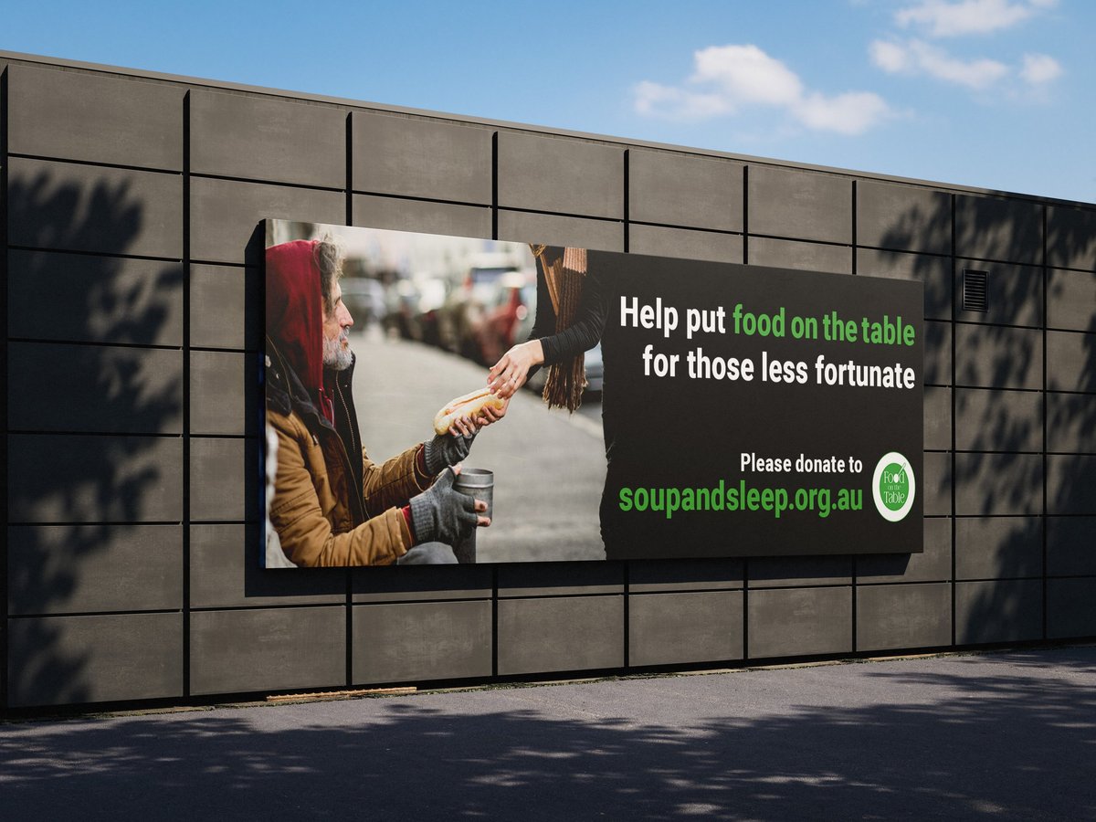 Charity billboard showing a child reaching out, with text Help put food on the table for those less fortunate and soupandsleepo.org.uk website