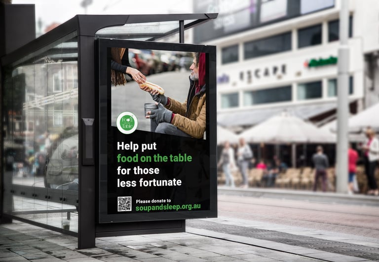 Charity billboard advertisement in bus shelter with message about donating food to those in need